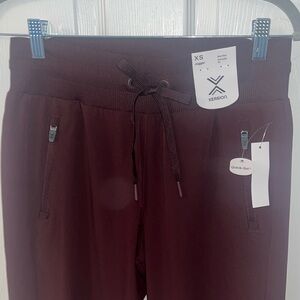 Very dark red/purple extra small joggers by quick dri.